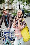 Woman fastening bicycle helmet