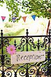 'Reception' sign on wrought iron fence