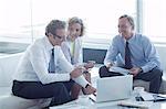 Business people talking in office lobby area