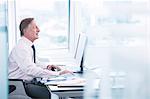 Businessman working on computer at desk