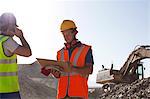 Workers standing in quarry