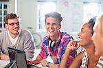 Friends talking at desk