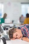 Businessman sleeping at desk