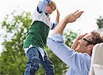 Father and son high fiving outdoors