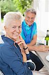 Couple smiling together at table