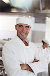 Chef smiling in restaurant kitchen