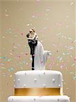Confetti falling on wedding cake