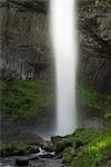 Waterfall in rocky rural landscape