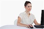 Businesswoman using a monitor against a white background