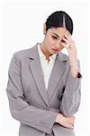 Young saleswoman looking sad against a white background