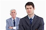 Close up of businessman with his boss behind him against a white background