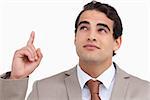 Close up of salesman looking and pointing up against a white background