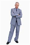 Mature tradesman with his arms folded against a white background