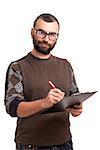 Portrait of a young man writing on a clipboard