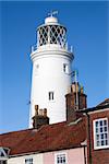 Southwold Lighthouse, Suffolk, England, against a blue sky.