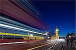 Big Ben in the evening. Dabldekker passes and leaves a line of light at slow shutter speeds. Photograph taken with the tilt-shift lens, vertical lines of architecture preserved