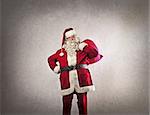 Santa Claus with his sack on a dark white background