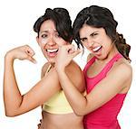 Giggling young athletic women flexing their biceps