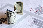 Business concept. One dollar bill as currency sign on paper background with business chart