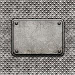 Grunge style background with metal rivets and stone plaque
