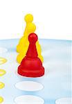 Red and yellow game pawns white isolated. Lideship conception