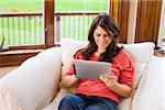 Woman Using iPad at Home