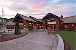 Entrance to a ranch home exterior at dusk