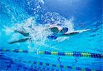 Female swimmer in United States swimsuit while swimming in pool