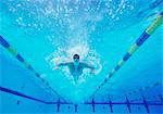 Underwater shot of male swimmer swimming in pool