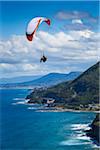 Paragliding looking south towards Wollongong from Bald Hill Lookout, Bald Hill Headland Reserve, Illawarra, Wollongong, New South Wales, Australia