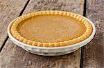 Pumpkin Pie on a Rustic Wooden Table