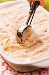 Scooping Homemade Peach Ice Cream