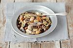 Herring salad with beans, dried mushrooms, onions and walnuts