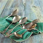 Assorted Silver Spoons on Felt Cloth