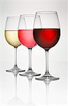 Three wine glasses (of white, rosÈ, and red wine)