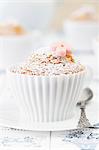 Muffins baked in silicon teacups on a Dutch tablecloth