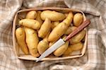 Overhead View of Potatoes in Basket with Knife