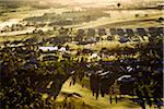 Aerial view of a hot air balloon over golf course and housing estate in wine country near Pokolbin, Hunter Valley, New South Wales, Australia