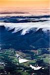 Aerial view of wine country near Pokolbin as mist comes in over the Brokenback Range, Hunter Valley, New South Wales, Australia