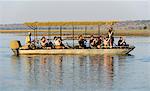 Tour boat on Chobe River near Kasane, Chobe National Park, Botswana, Africa