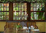 South America, Brazil, Paraty, Costa Verde, Green Coast,, the dining room at Le Gite DIndaiatiba pousada and restaurant, set in the Atlantic Coastal rainforest in Grauna near Paraty and with cutlery by the Santa Semente atelier