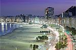 South America, Brazil, Rio de Janeiro, general view of Copacabana Beach at night showing the new beachside cafes, apartment blocks and the Atlantic Avenue