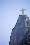 South America, Brazil, Rio de Janeiro State, Rio de Janeiro city, Corcovado, a helicopter flying next to the art deco Christ statue, Cristo Redentor, on Corcovado