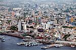 South America, Brazil, Amazonas state, Manaus, aerial view of the city centre of Manaus showing river boats at the floating docks, the Adolpho Lisboa market and the Opera House