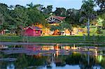 South America, Brazil, Mato Grosso, Sao Jose do Rio Claro, the lake, main buildings at the Jardim da Amazonia jungle lodge and pousada in the Brazilian Amazon