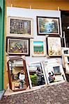 South America, Brazil, Sao Paulo, Embu das Artes, paintings and mirrors for sale outside a shop during the arts and crafts weekend market