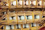 China, Yunnan, Yuanyang. Duck eggs wrapped in straw, Yuanyang.