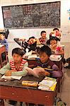 China, Yunnan, Jinghong. School children in a village near Jinghong.