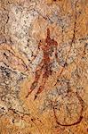 Chad, Guili Dweli, Ennedi, Sahara. A rock painting of a man with a long curved stick or lance.