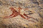 Chad, Terkei East, Ennedi, Sahara. A painting on sandstone of a galloping horse and rider.